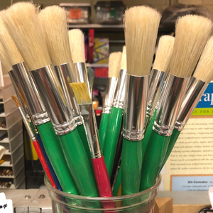Green handled paint brushes.